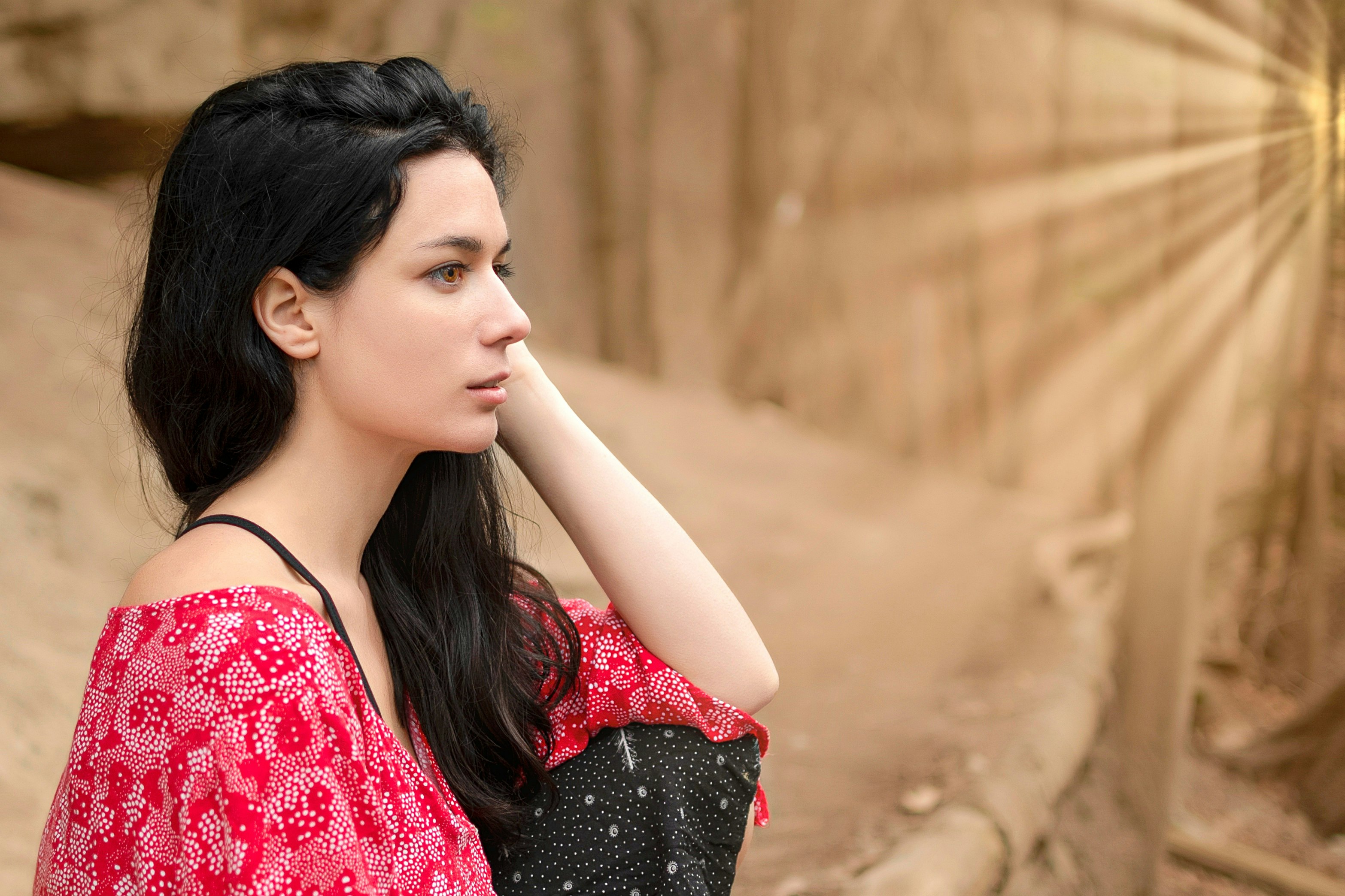 woman in red and black floral dress